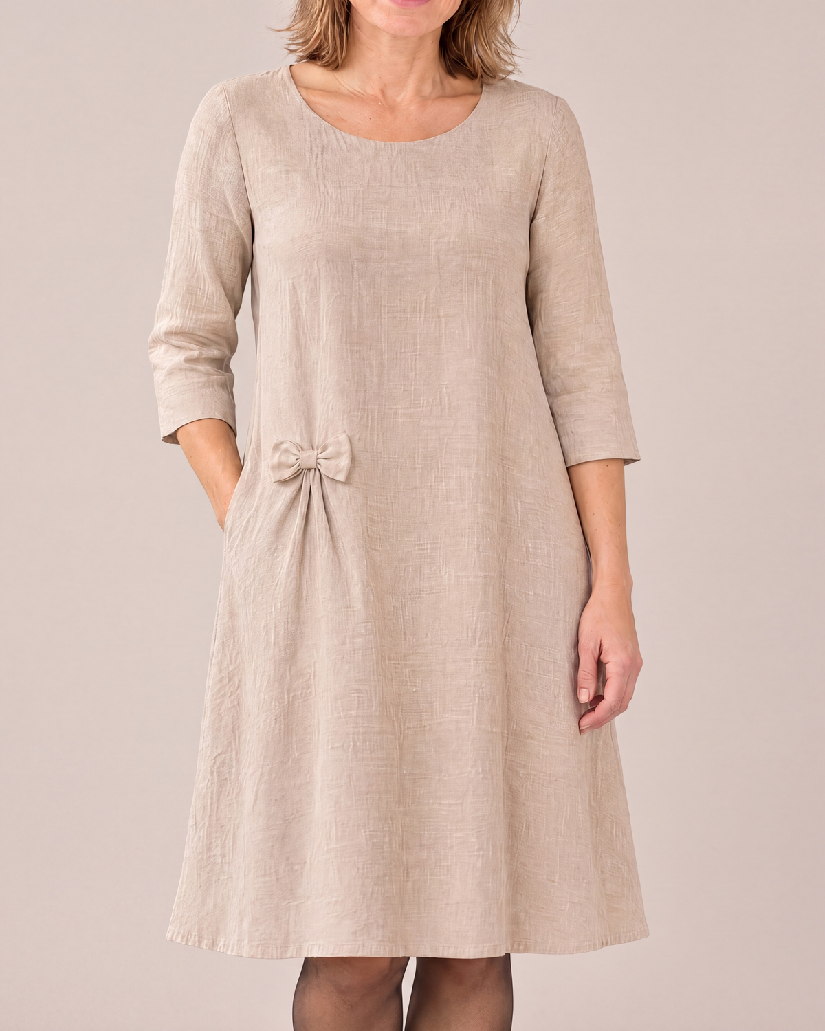 ADELE linen swing dress in beige with a small detachable hip bow, close front view