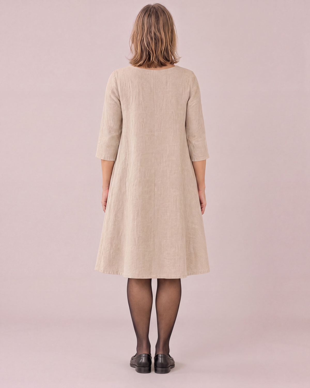ADELE beige linen swing dress, back view with centre back seam