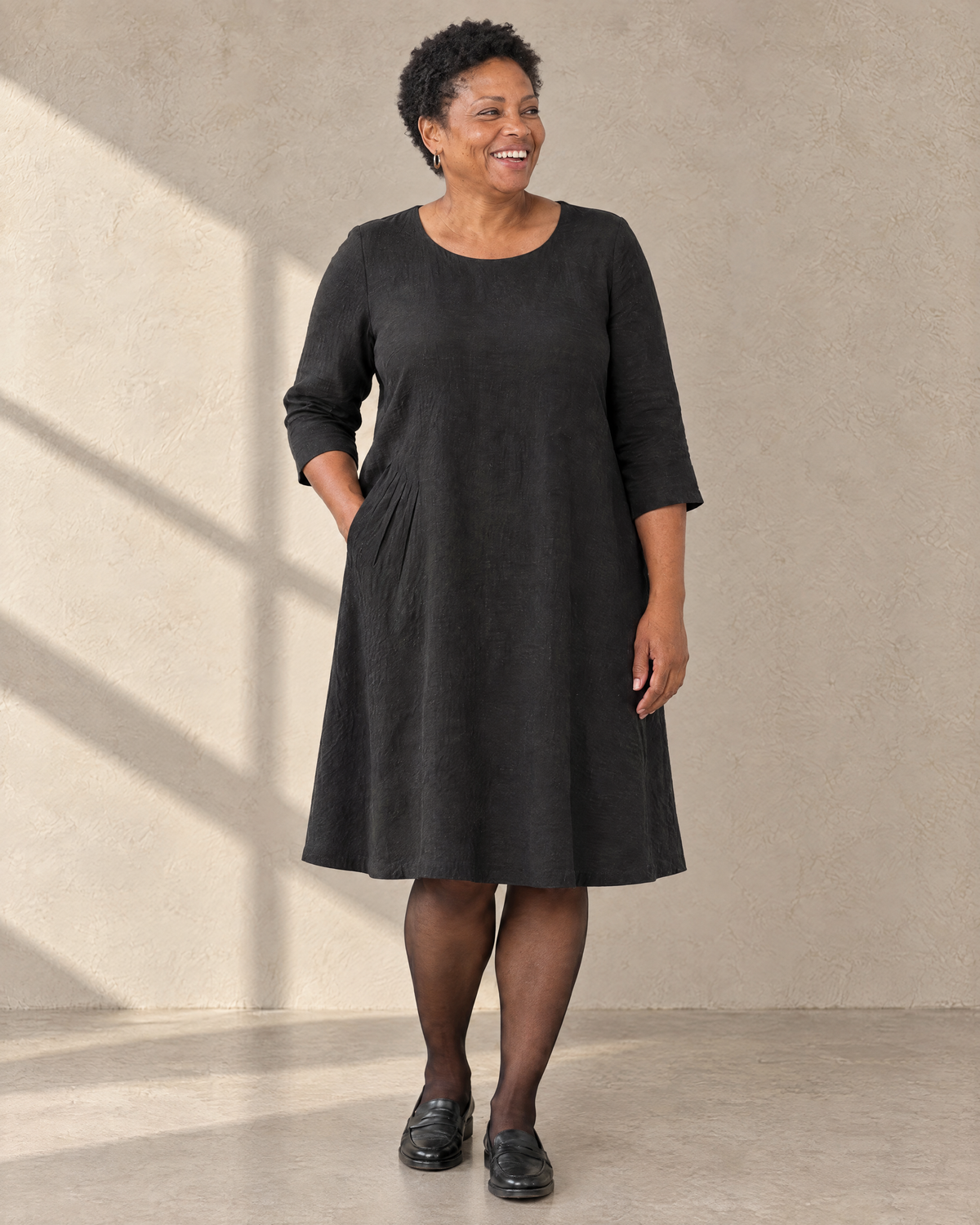 ADELE linen swing dress in black worn without the bow, front view