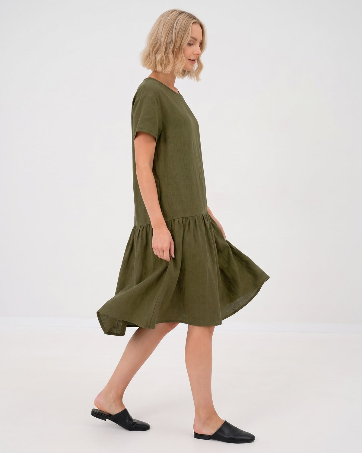 LeMuse BLOSSOM linen dress in olive green – side, skirt in motion #Color_Olive green