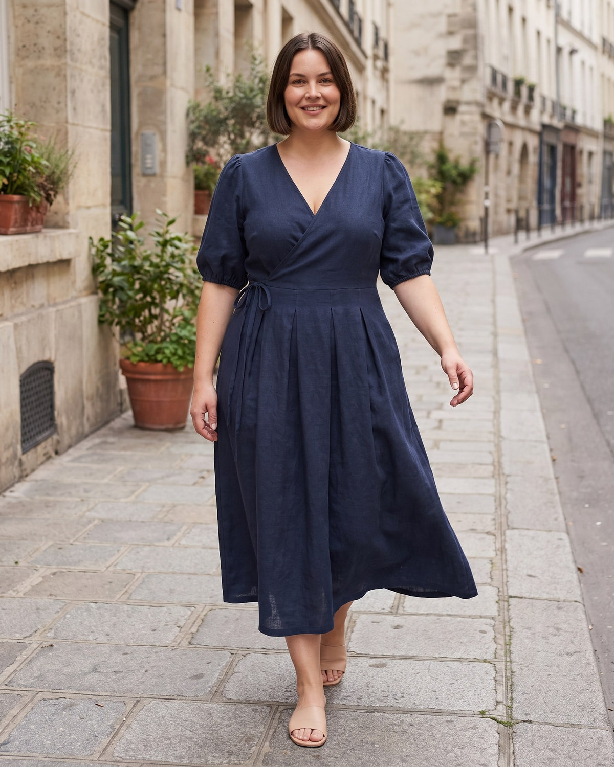 BONNIE – Linen Blend Puff Sleeve Tie-Waist Midi Dress – Deep blue suknelė, lifestyle photo, walking on a city street #Color_Deep blue