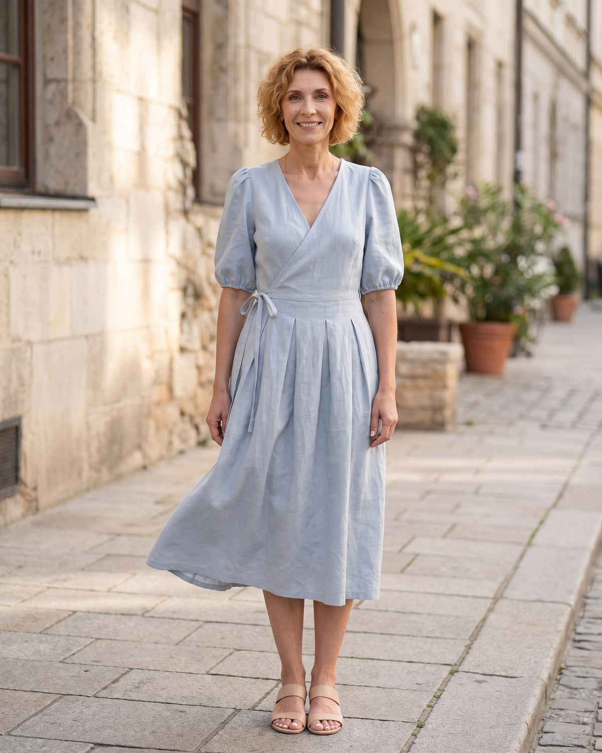 BONNIE – Linen Blend Puff Sleeve Tie-Waist Midi Dress – Light blue suknelė, lifestyle photo, walking on a city street #Color_Light blue