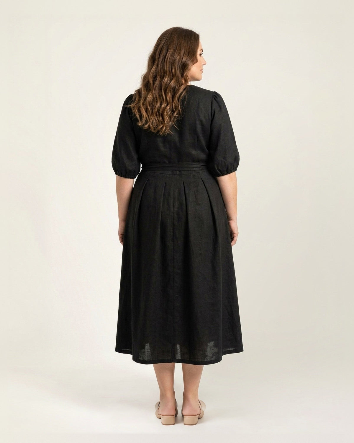 BONNIE SUPERSTAR – Linen Blend Puff Sleeve Tie-Waist Dress — Plus Size – black linen dress, full-length back view in the studio #Color_Black