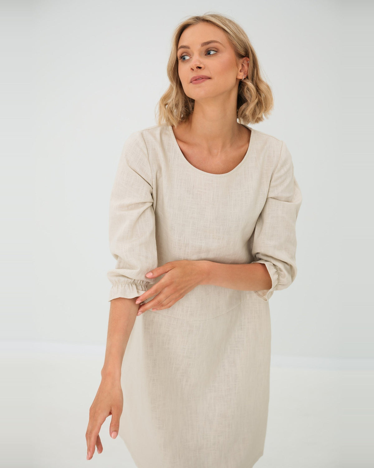 EMMA – Linen Blend Three-Quarter Sleeve Belted Dress – beige dress without belt, studio view of the round neckline #Color_Beige