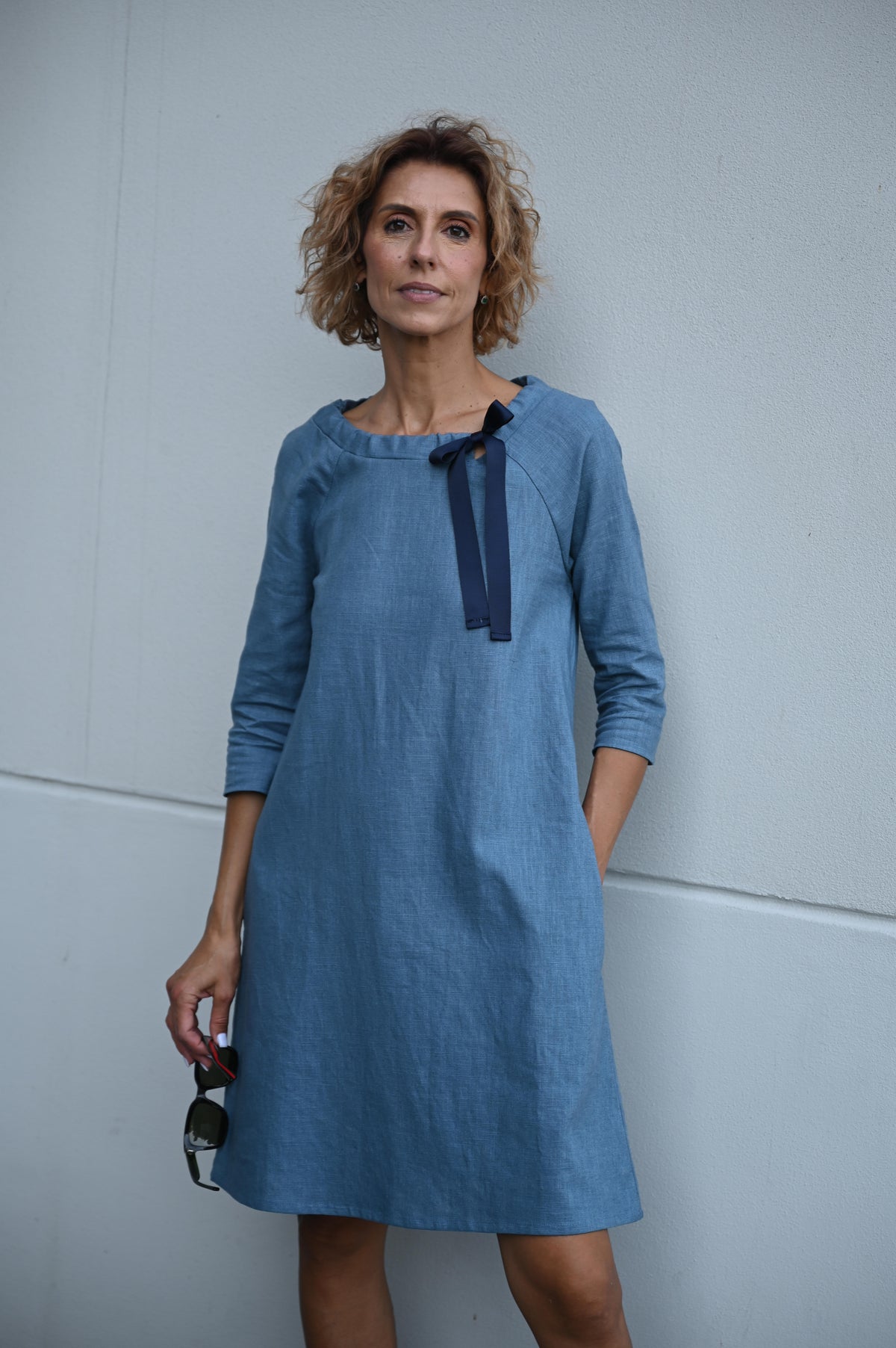 LeMuse FRENCH linen dress in blue – model front with ribbon bow #Color_Blue