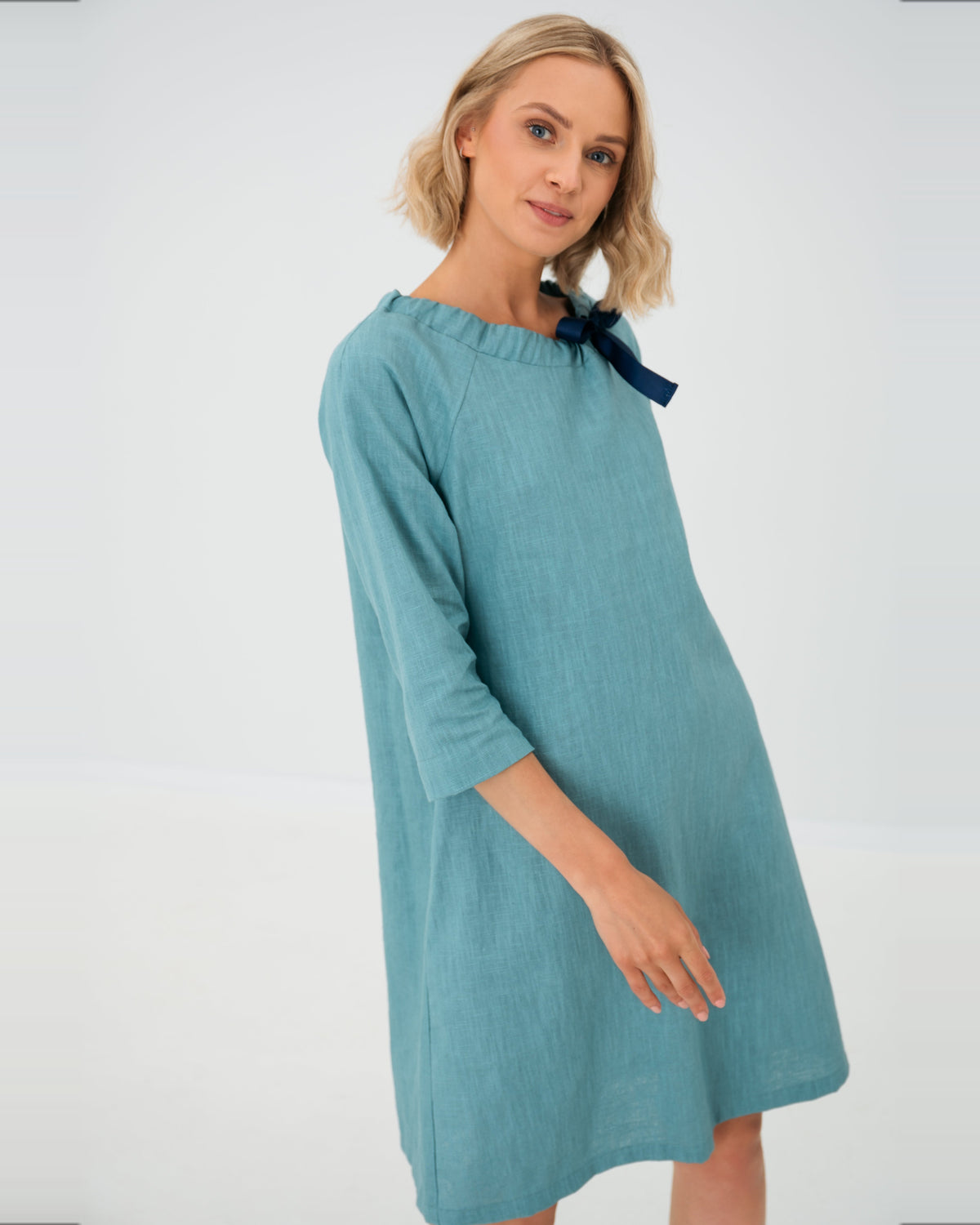 LeMuse FRENCH linen dress in teal – studio three-quarter front view hand at side #Color_Teal