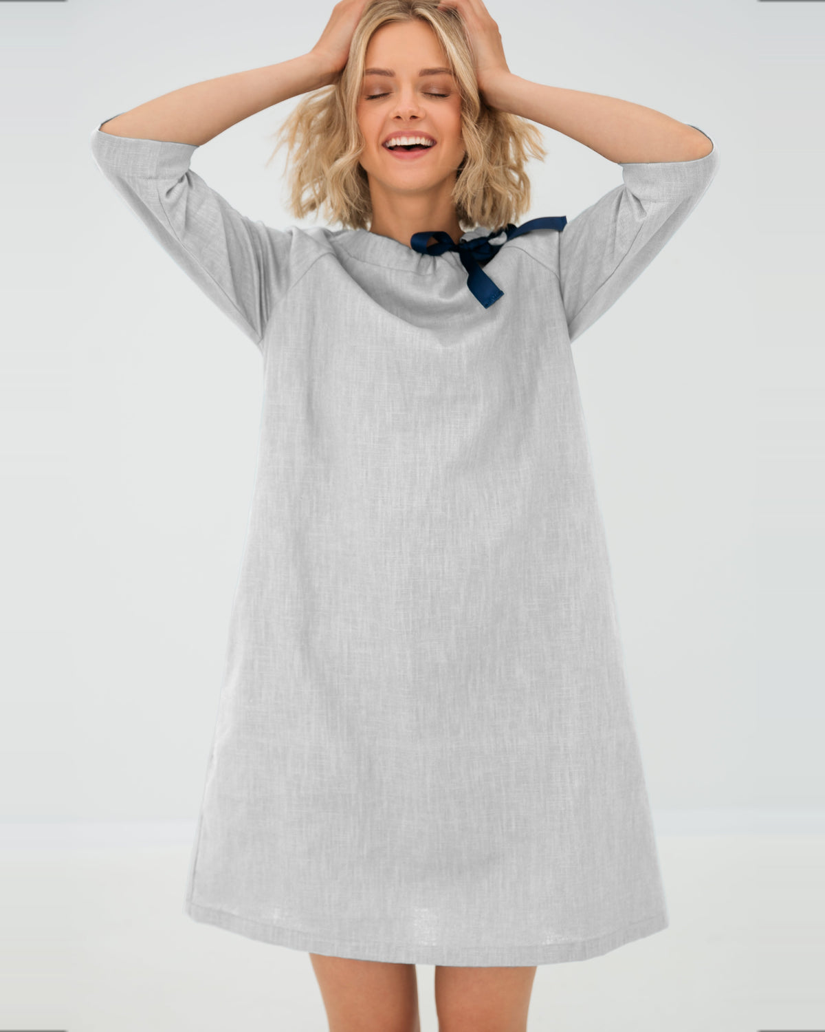 LeMuse FRENCH linen dress in white – model hands up in motion #Color_White