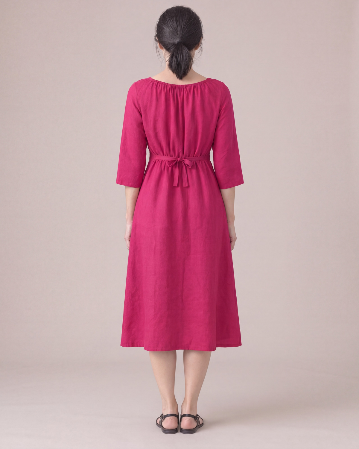 HELENA linen dress in Cerise, back view with tied waist