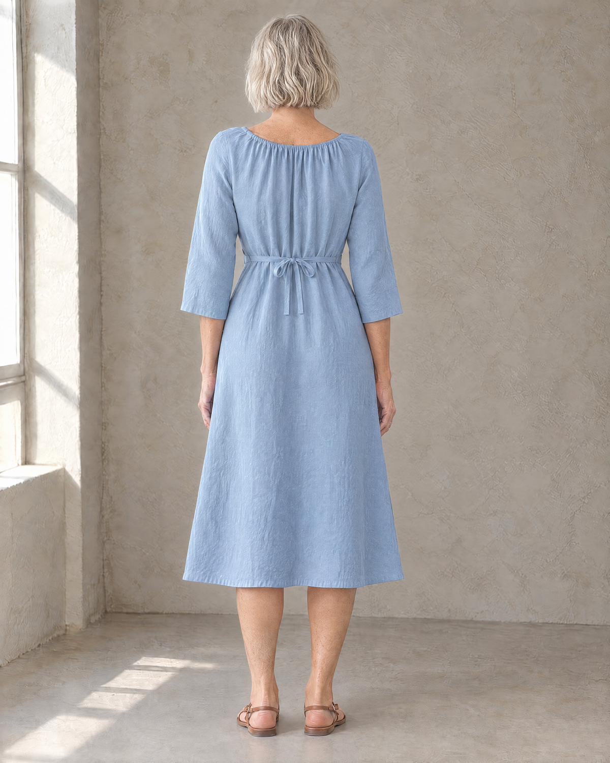 HELENA linen dress in Light Blue, back view with tied waist