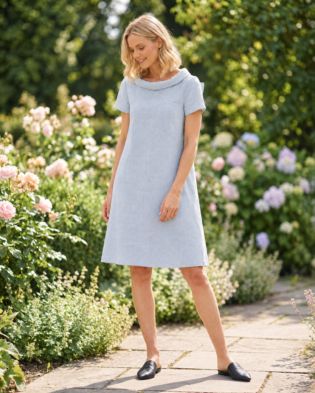 LeMuse STORY linen dress in light blue – lifestyle, sunlit street #Color_Light blue
