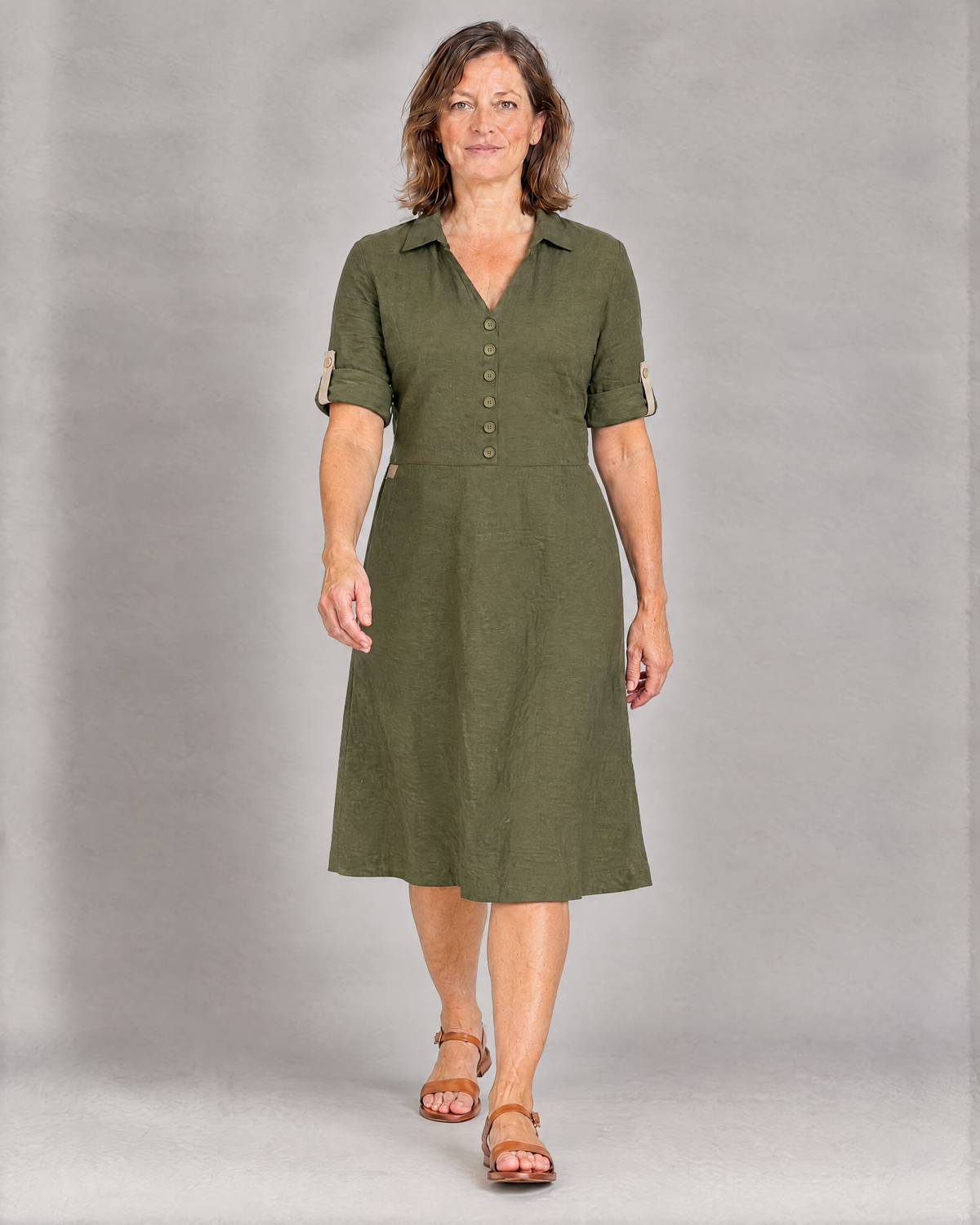 CARRY olive green linen midi shirt dress with sleeves rolled up and held by beige button tabs