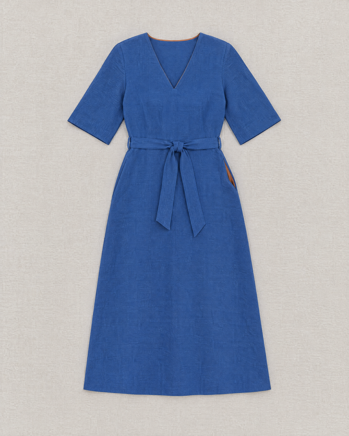 PASSPORT blue linen A-line midi dress laid flat with tie belt