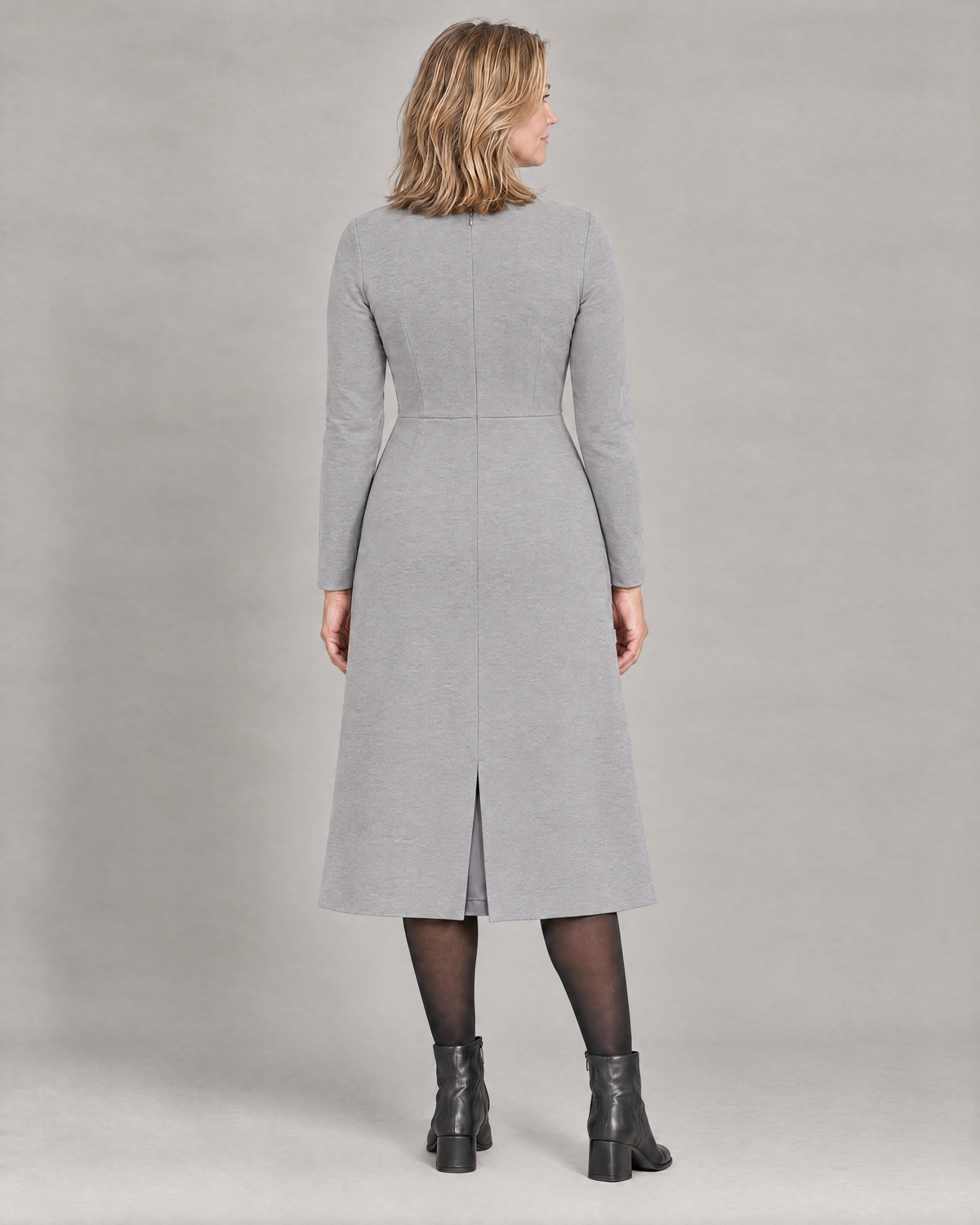 GLIDE light grey wool midi dress, back view with concealed zip and lined walking vent