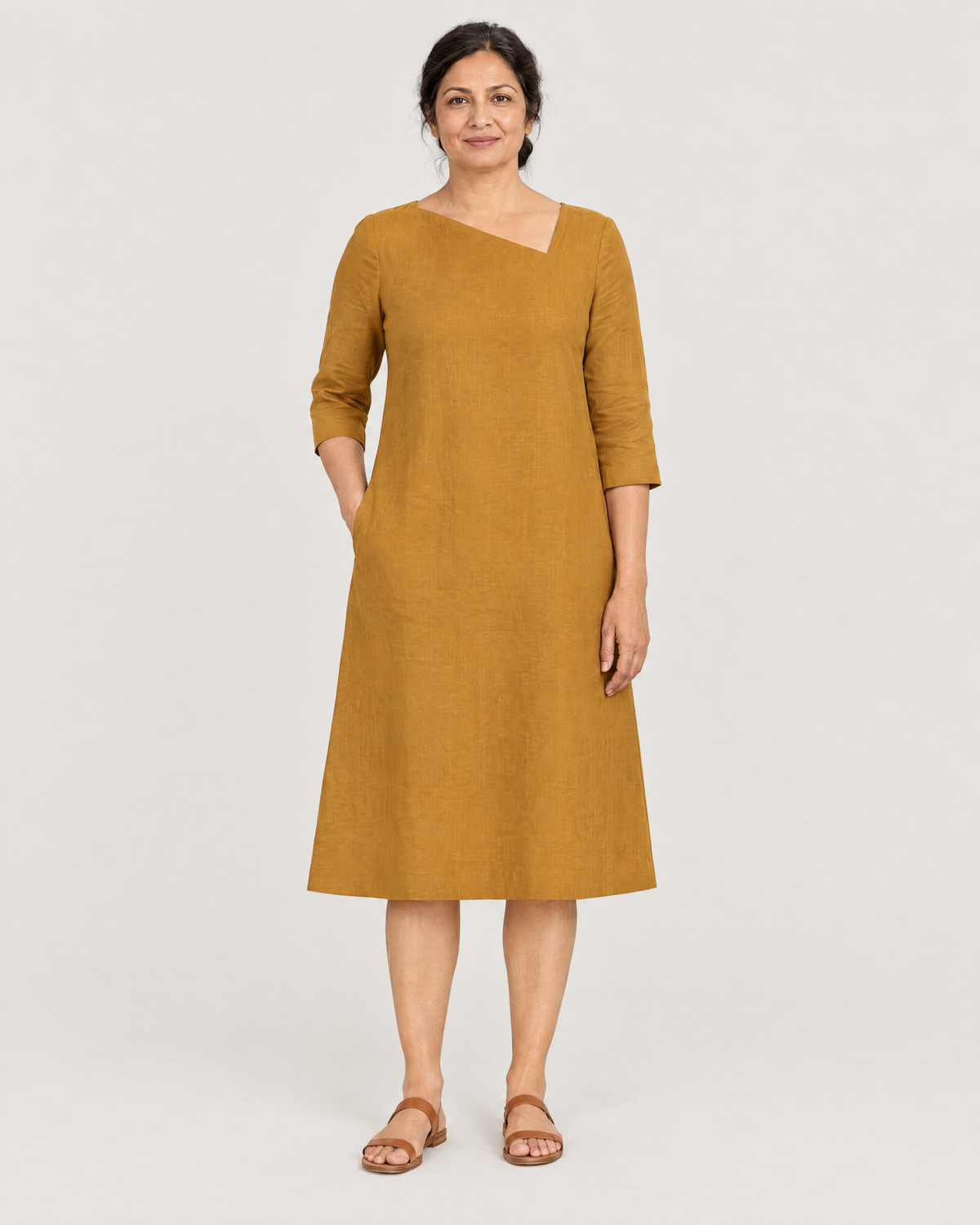 HUE ochre linen A-line dress with asymmetric neckline, front view