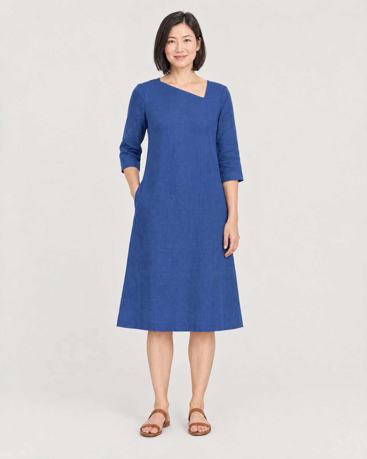 HUE blue linen A-line dress with asymmetric neckline, front view