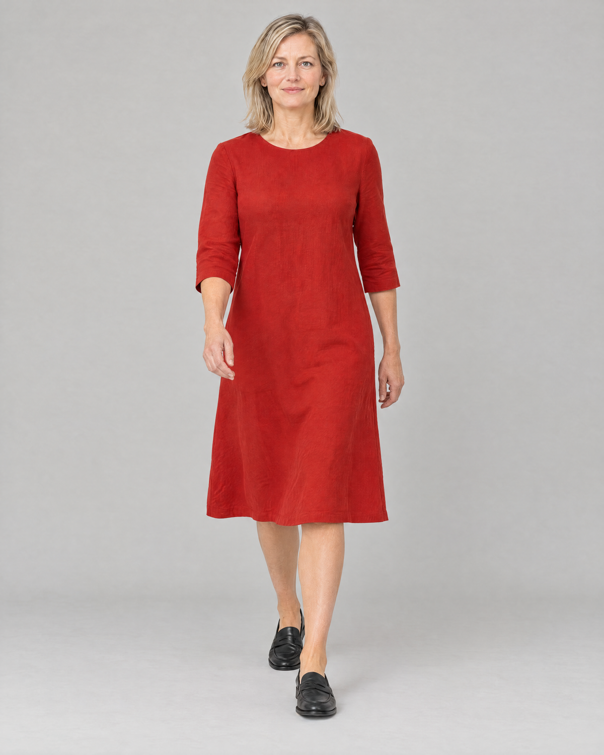 Woman walking in the BASE red linen A-line dress