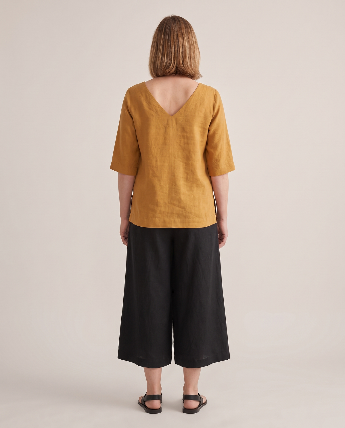 LIFT linen top in Ochre, back view with V neckline