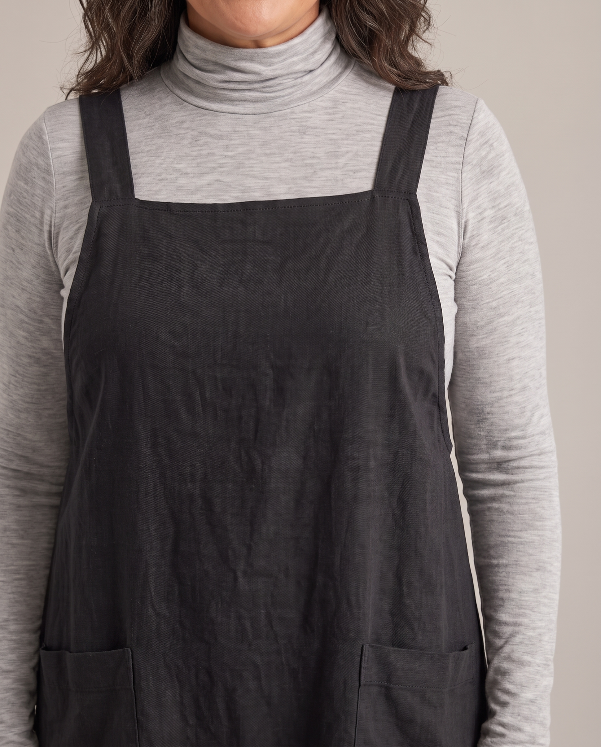 LAYER linen pinafore dress in Black, neckline and pocket detail