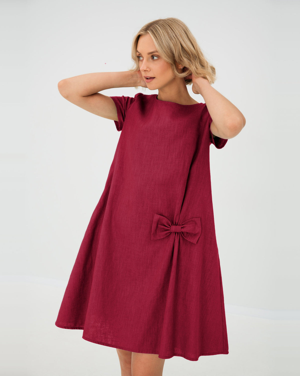 LeMuse SUMMER KISS linen dress in cerise – studio front view, hands in hair #Color_Cerise