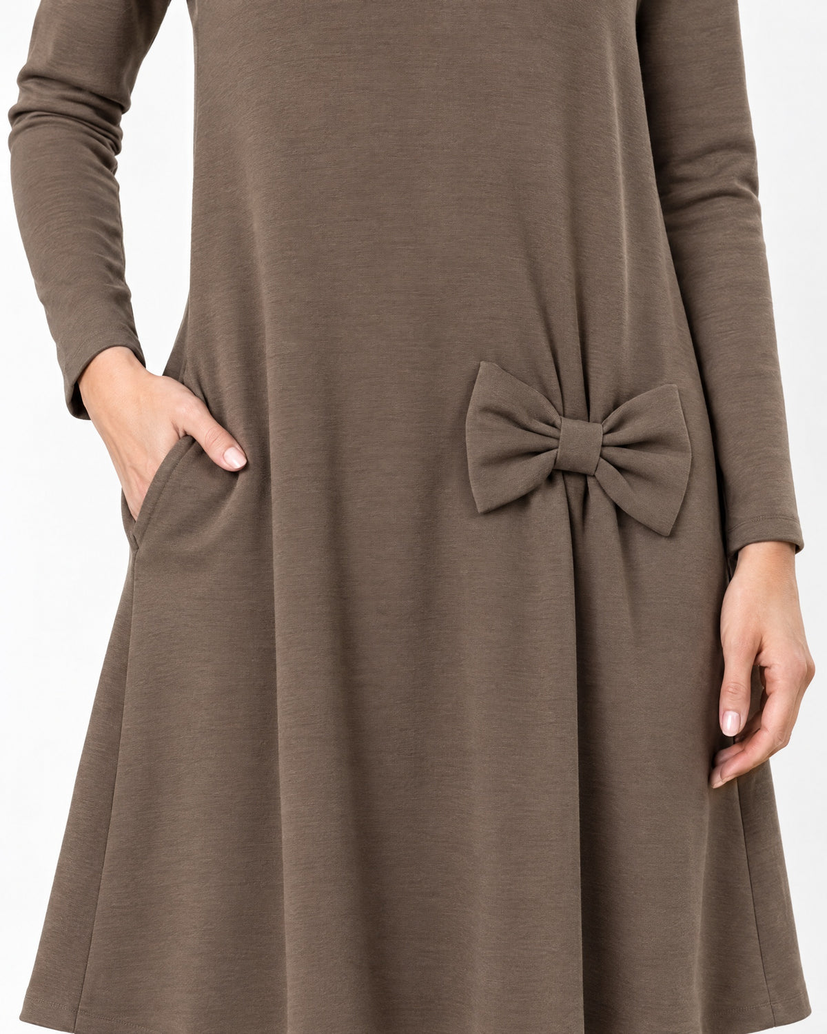 Close-up of a brown long-sleeve A-line dress showing the side pocket, bow detail and Punto Milano knit fabric texture. #Color_Brown
