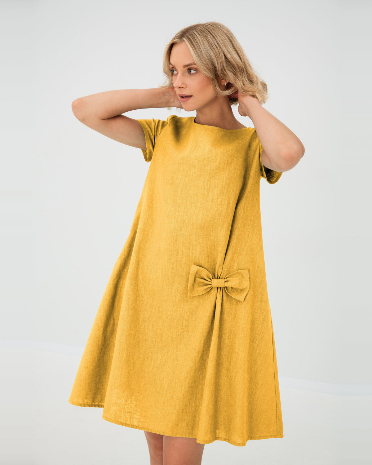 LeMuse SUMMER KISS linen dress in yellow – studio front view, hands in hair #Color_Yellow