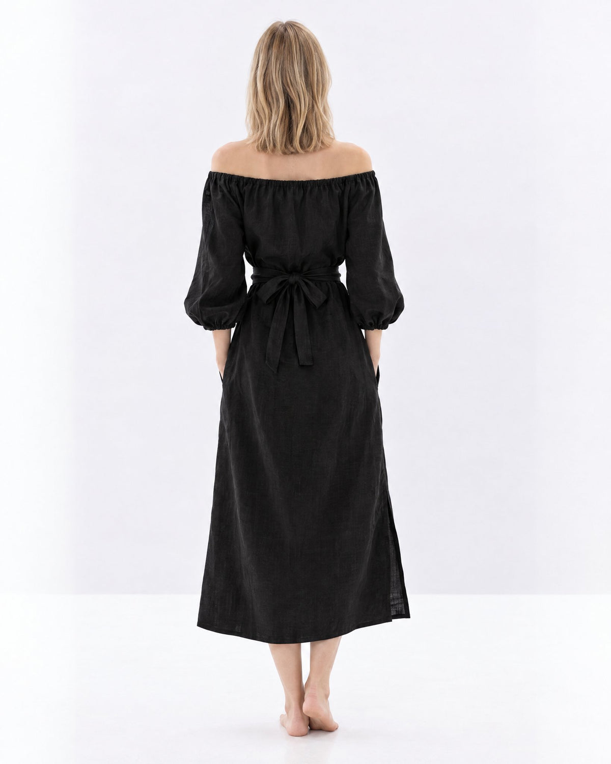 MOON – Black off-shoulder linen midi dress, back view in studio #Color_Black
