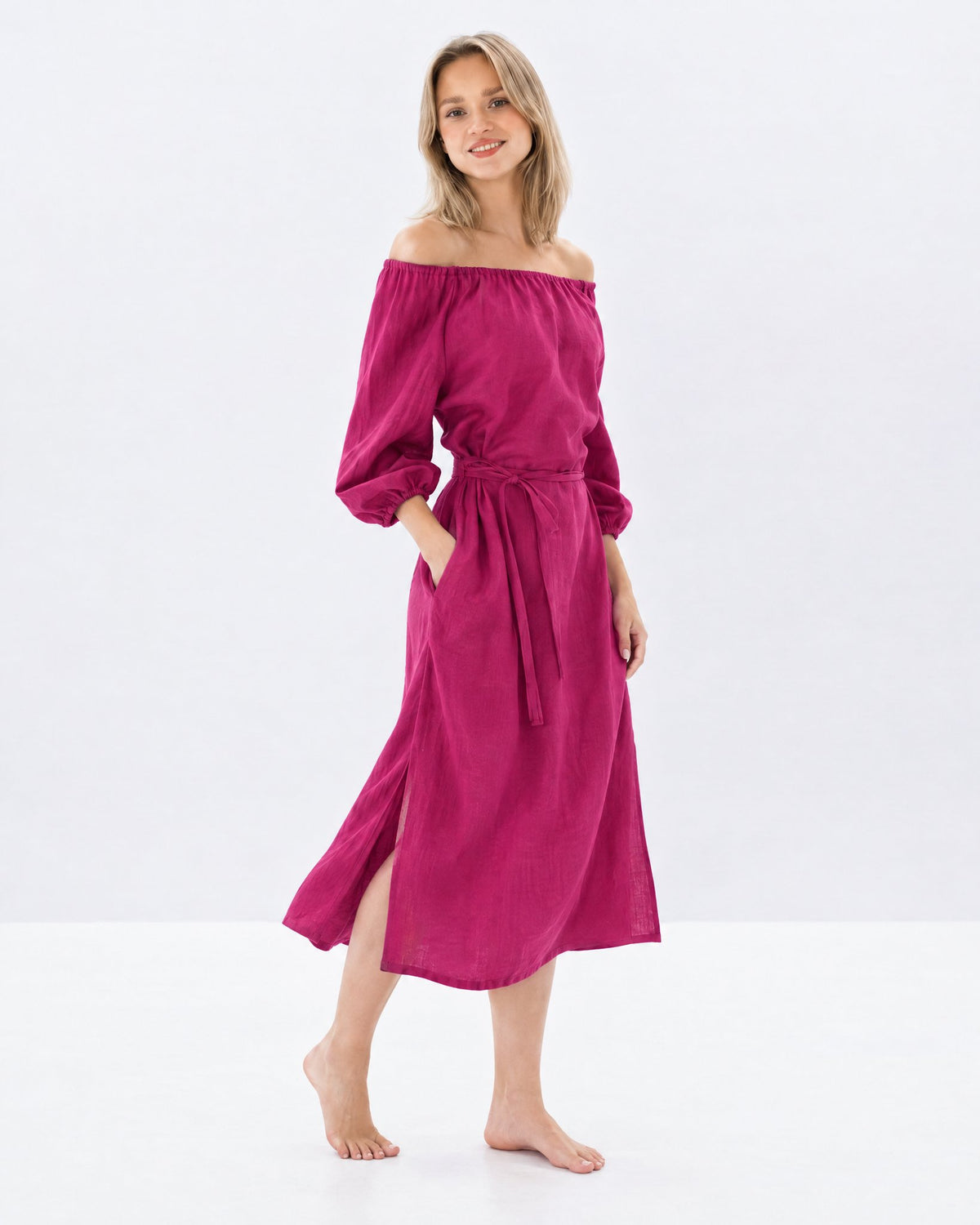 MOON – Cerise off-shoulder linen midi dress, side view walking in studio #Color_Cerise
