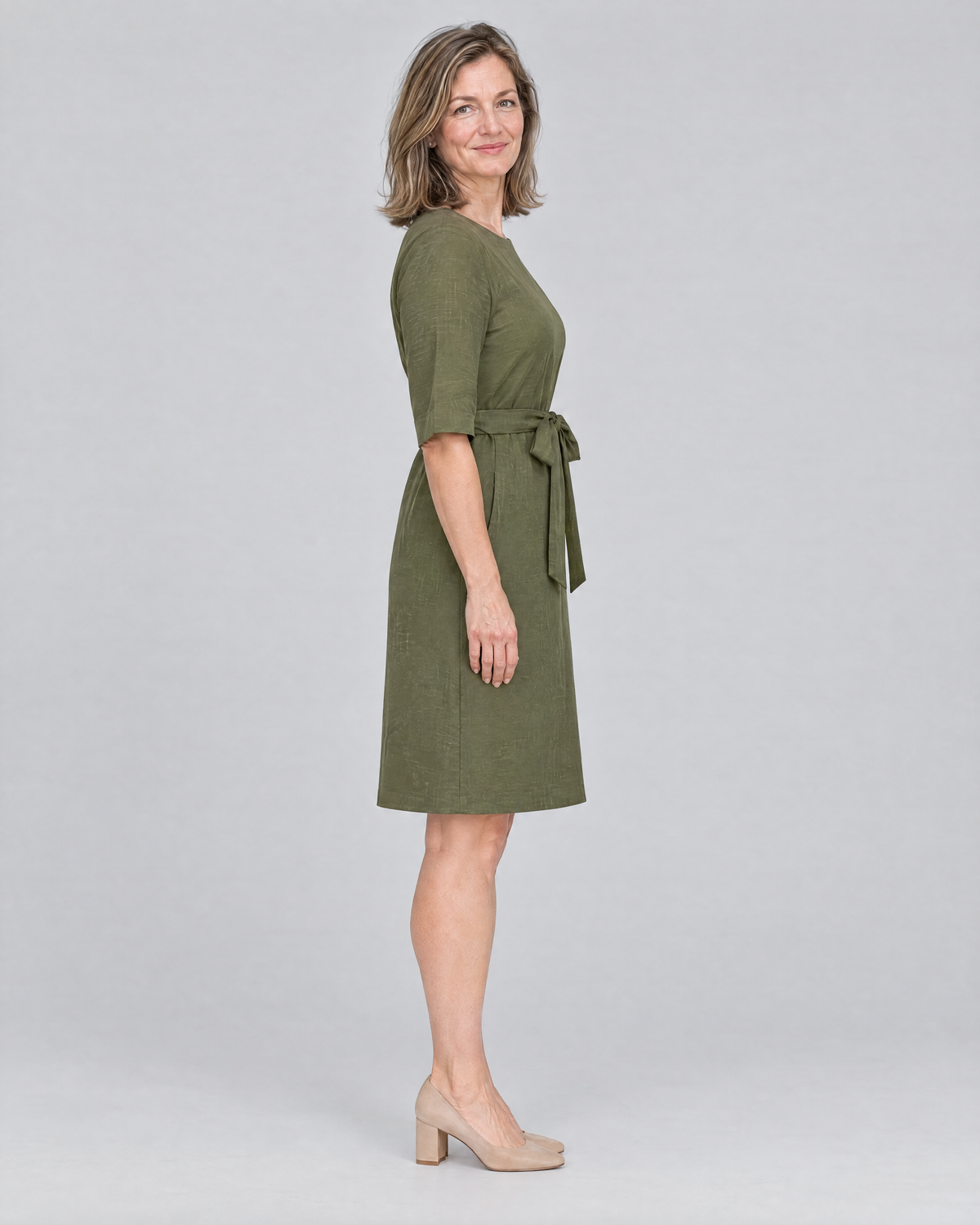 REACH linen dress in Olive Green, side view showing the relaxed sleeve