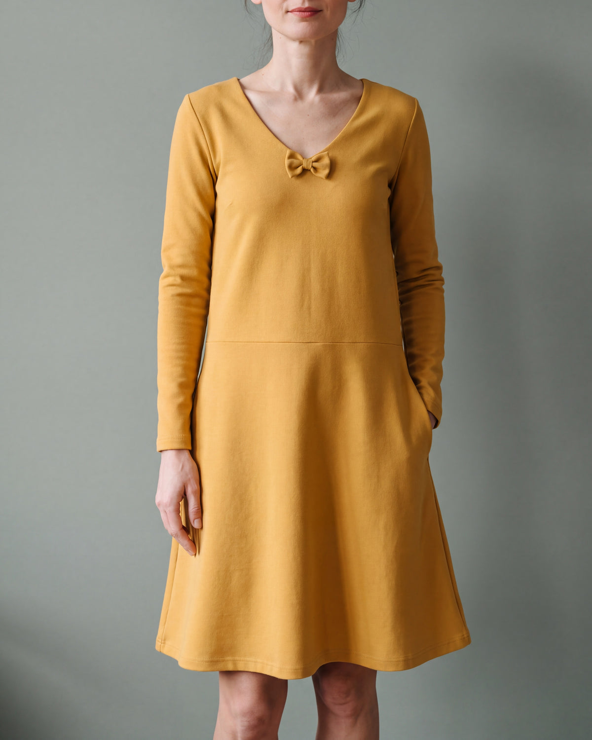 SUN yellow Punto Milano V-neck bow dress, close front view