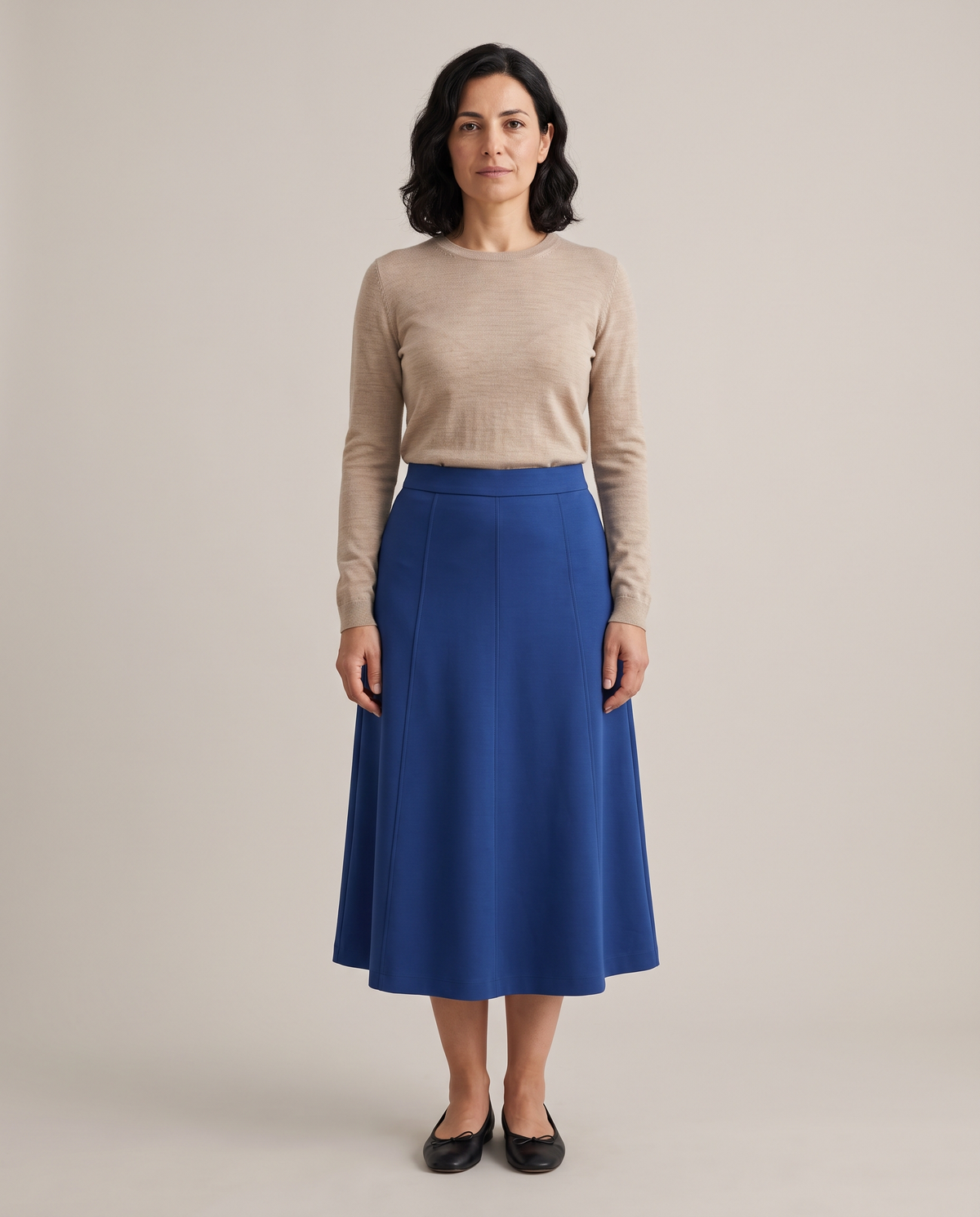STEP midi skirt in Cobalt, front view with a tucked-in knit