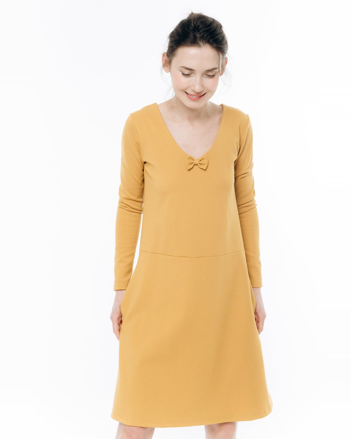 SUN – Italian Punto Milano V-Neck Bow Dress – yellow dress, front waist-up view with V-neck bow and dropped waist seam #Color_Yellow