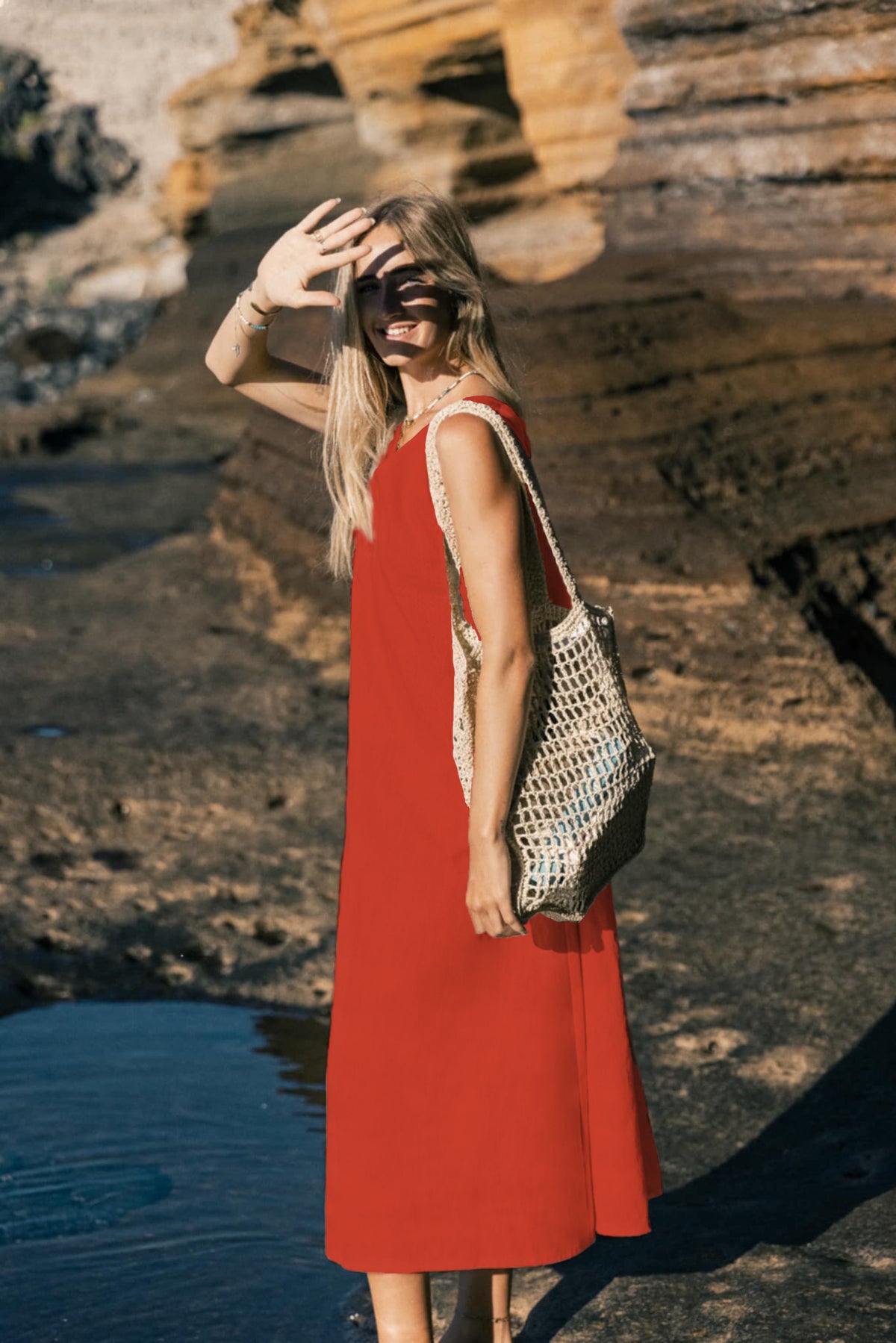 LeMuse SUNSET linen dress in orange – model front full length by the cliffs #Color_Orange