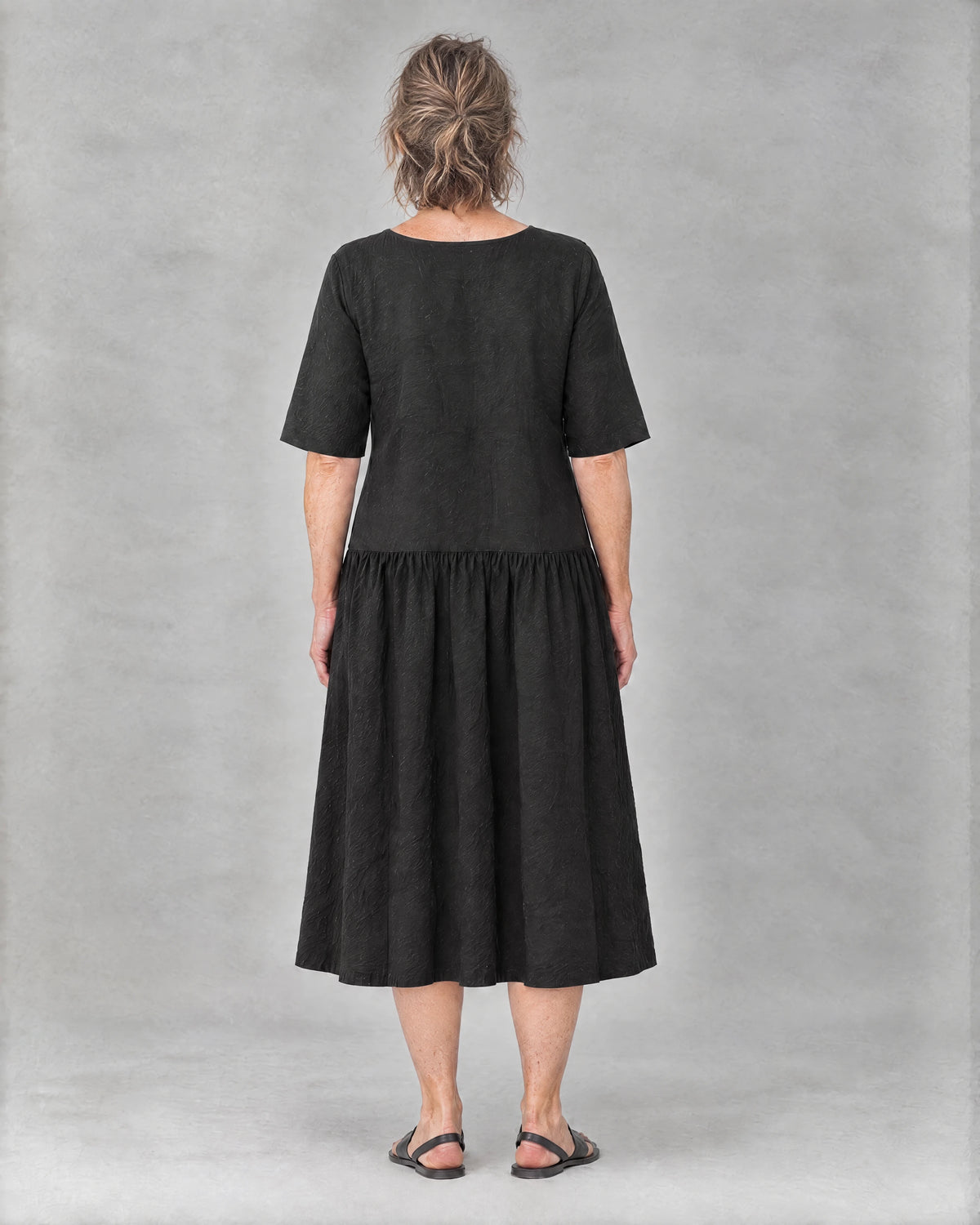 TESSA black linen tiered midi dress, back view