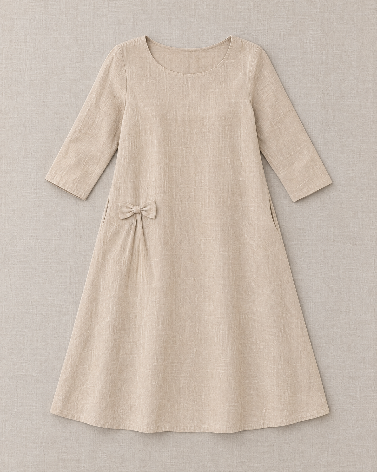 ADELE beige linen swing dress laid flat, full shape with hip bow