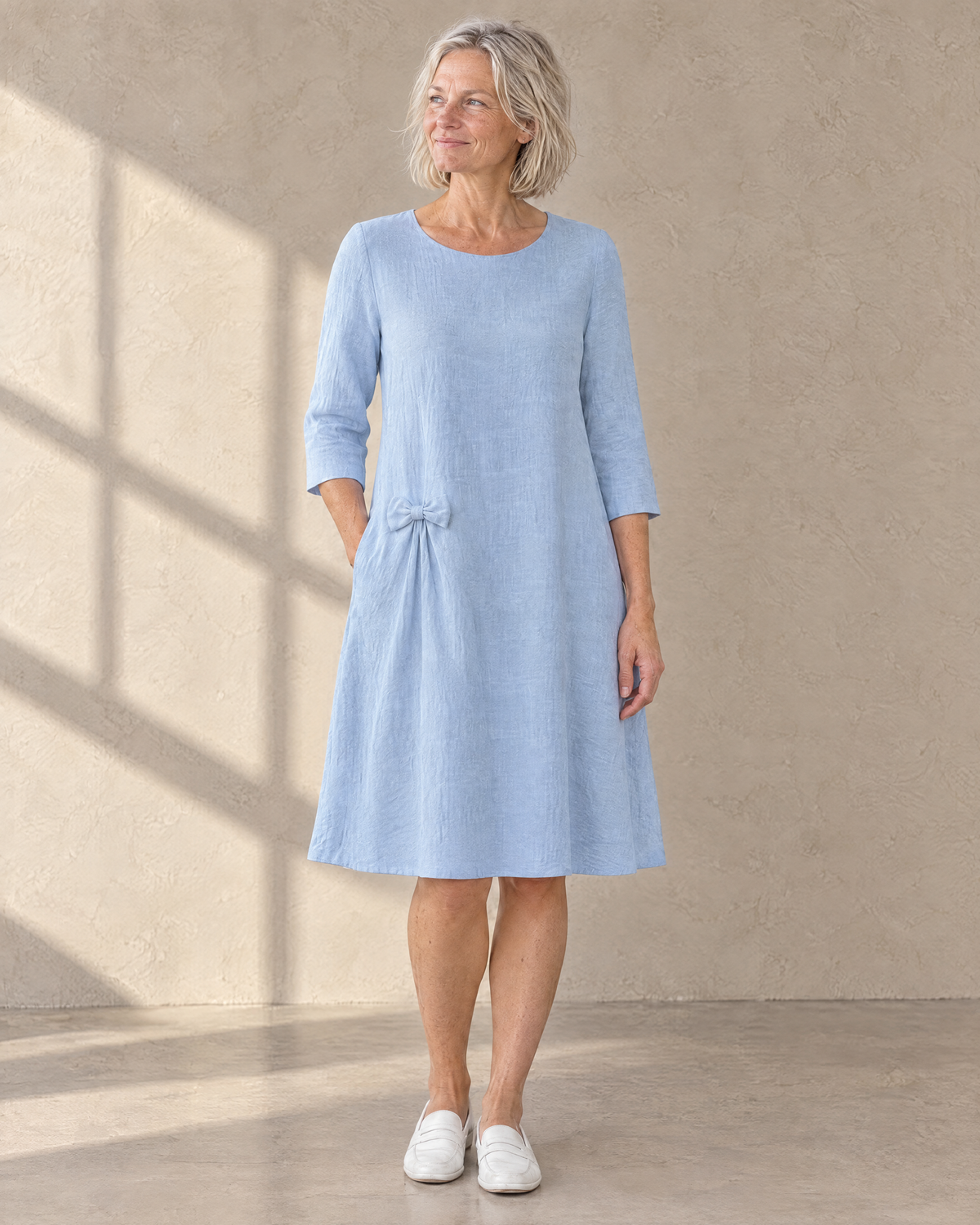 ADELE linen swing dress in light blue with small hip bow, front view