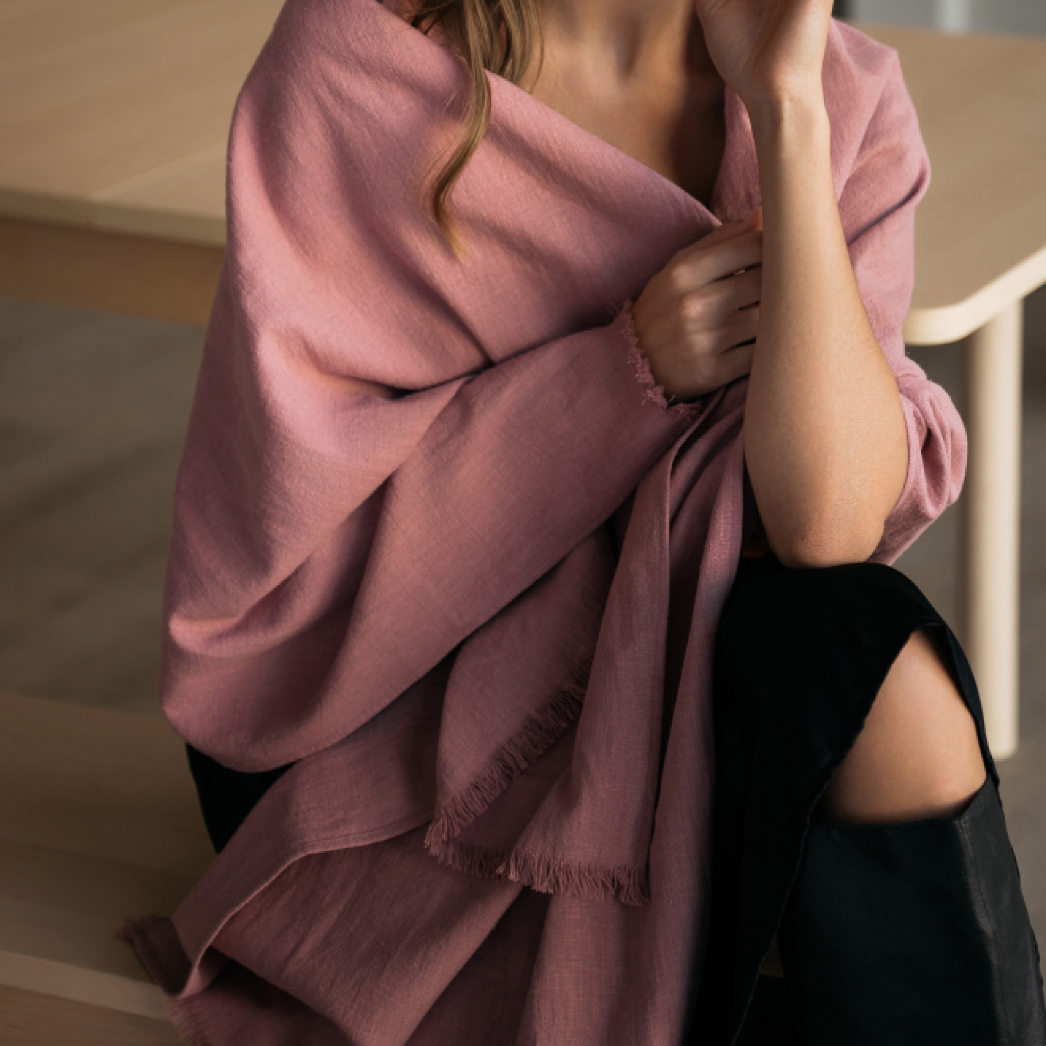 A dusty rose linen scarf with a fringed edge, shown draped. #Color_Dusty rose