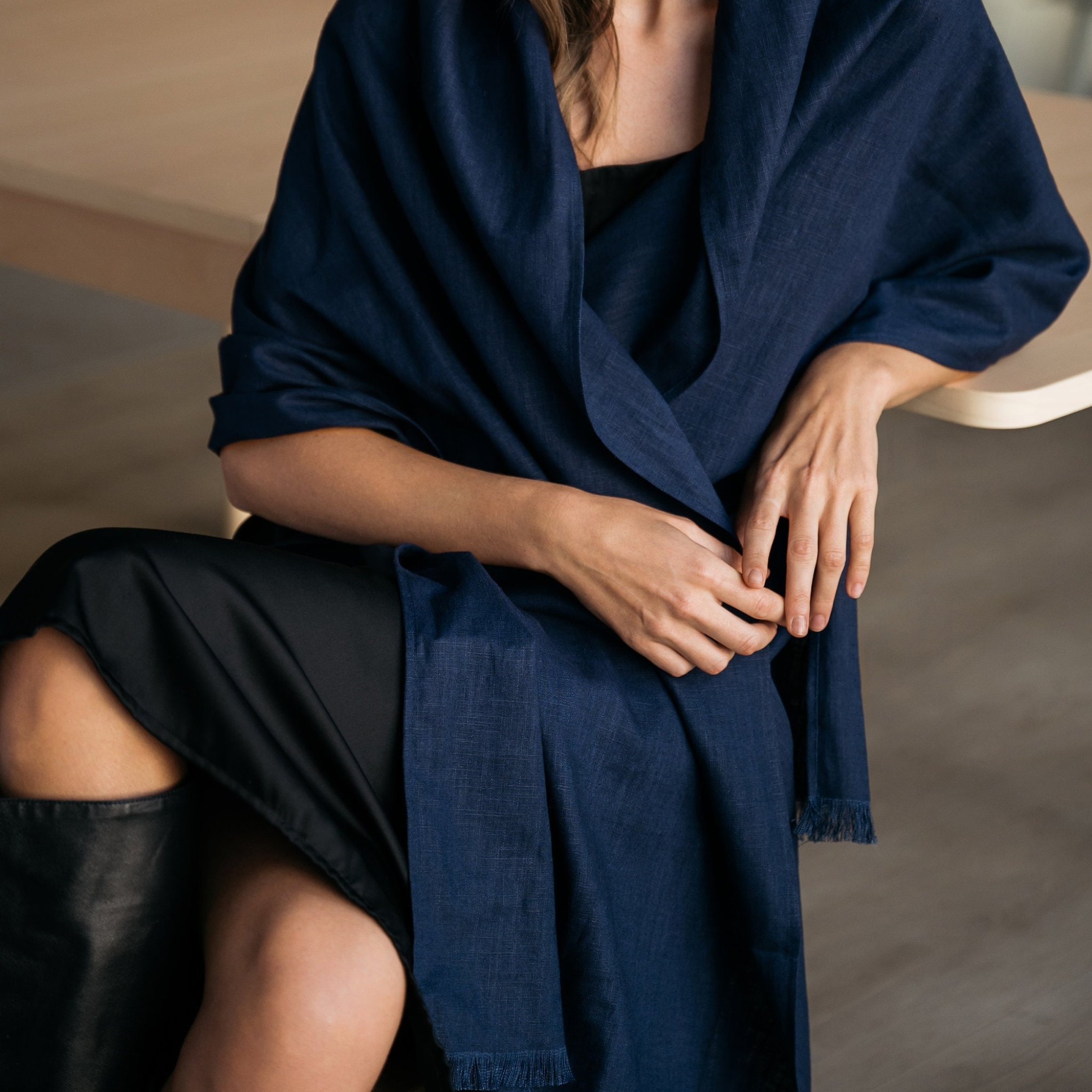 A navy blue linen scarf with a fringed edge, shown draped. #Color_Deep blue