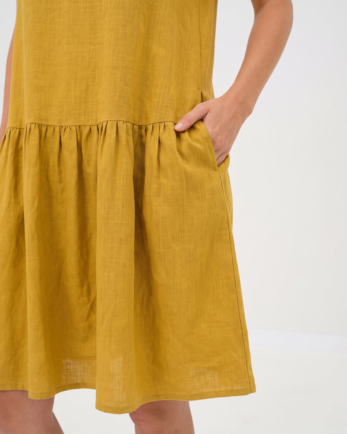 LeMuse BLOSSOM linen dress in ochre – fabric and pocket close-up #Color_Ochre