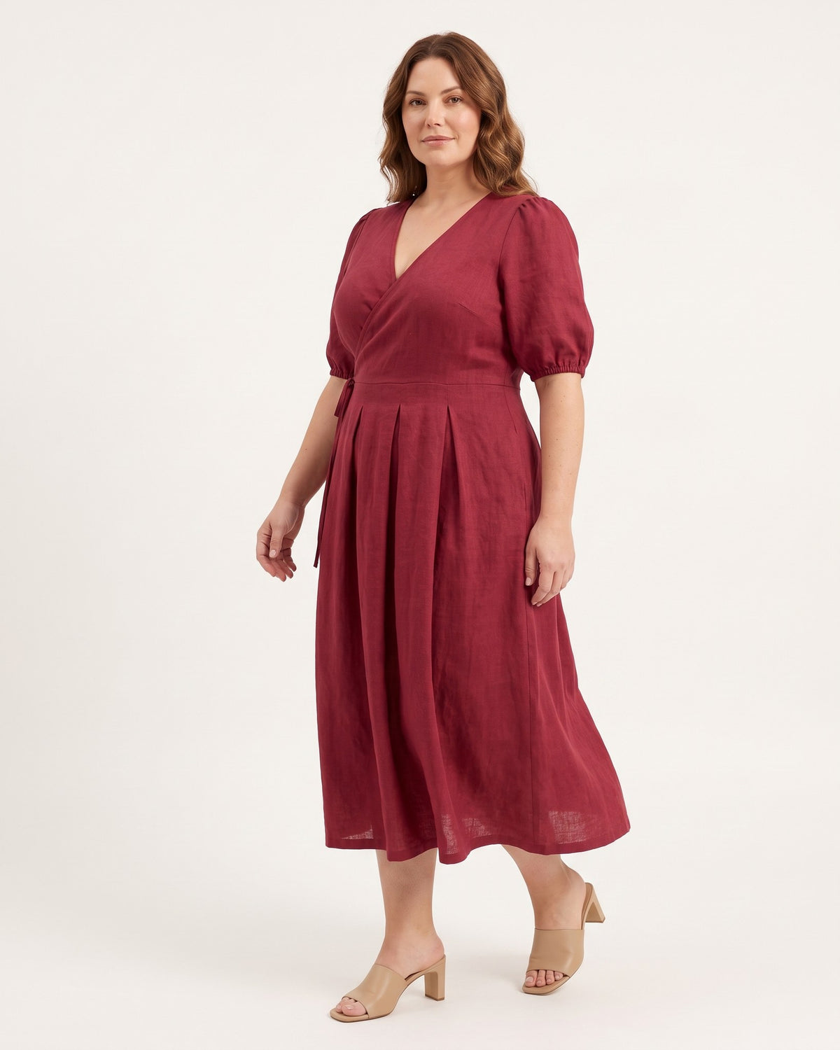 BONNIE – Linen Blend Puff Sleeve Tie-Waist Midi Dress – Burgundy suknelė, side view in motion, full length in studio #Color_Burgundy