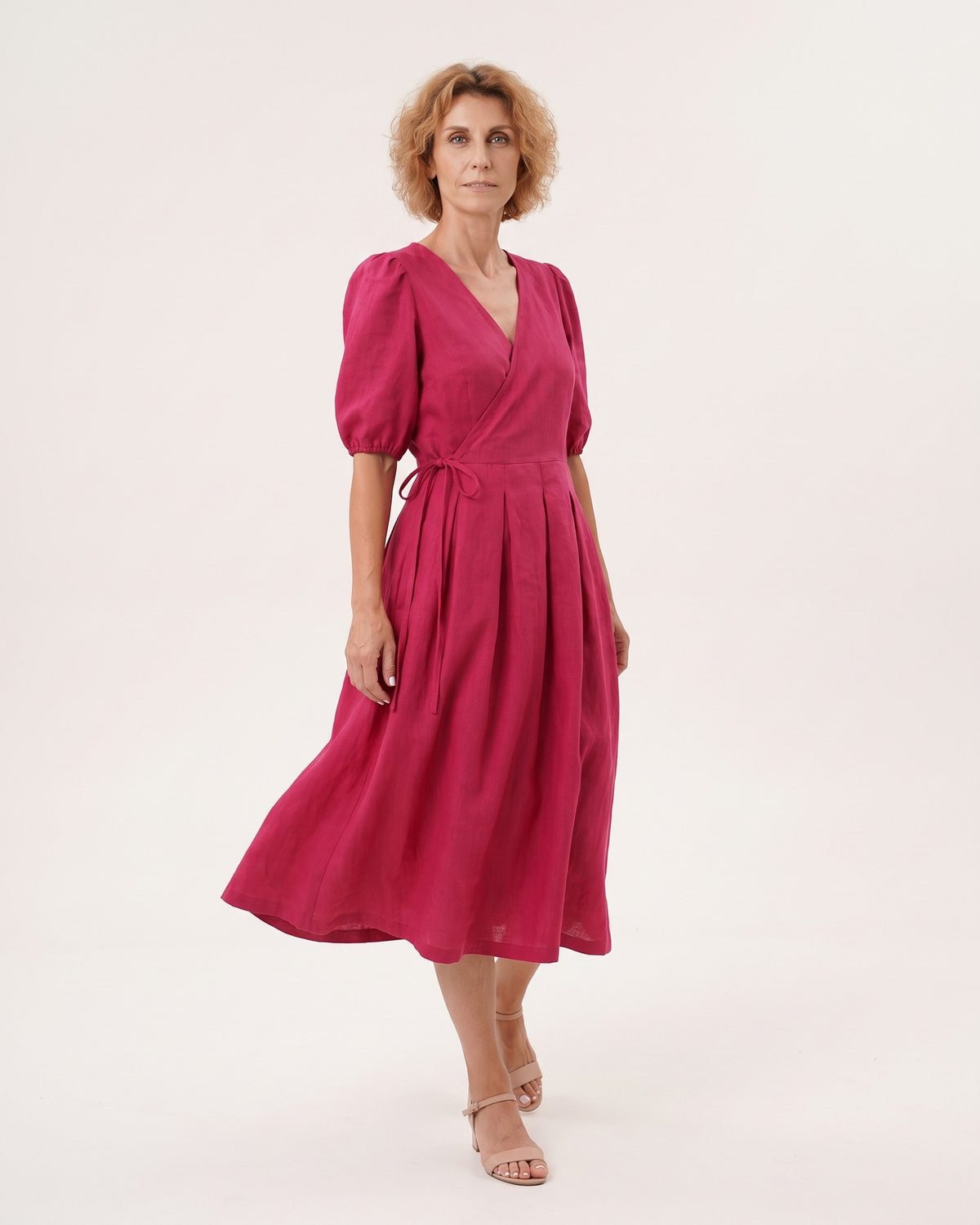 BONNIE – Linen Blend Puff Sleeve Tie-Waist Midi Dress – Cerise suknelė, side view in motion, full length in studio #Color_Cerise