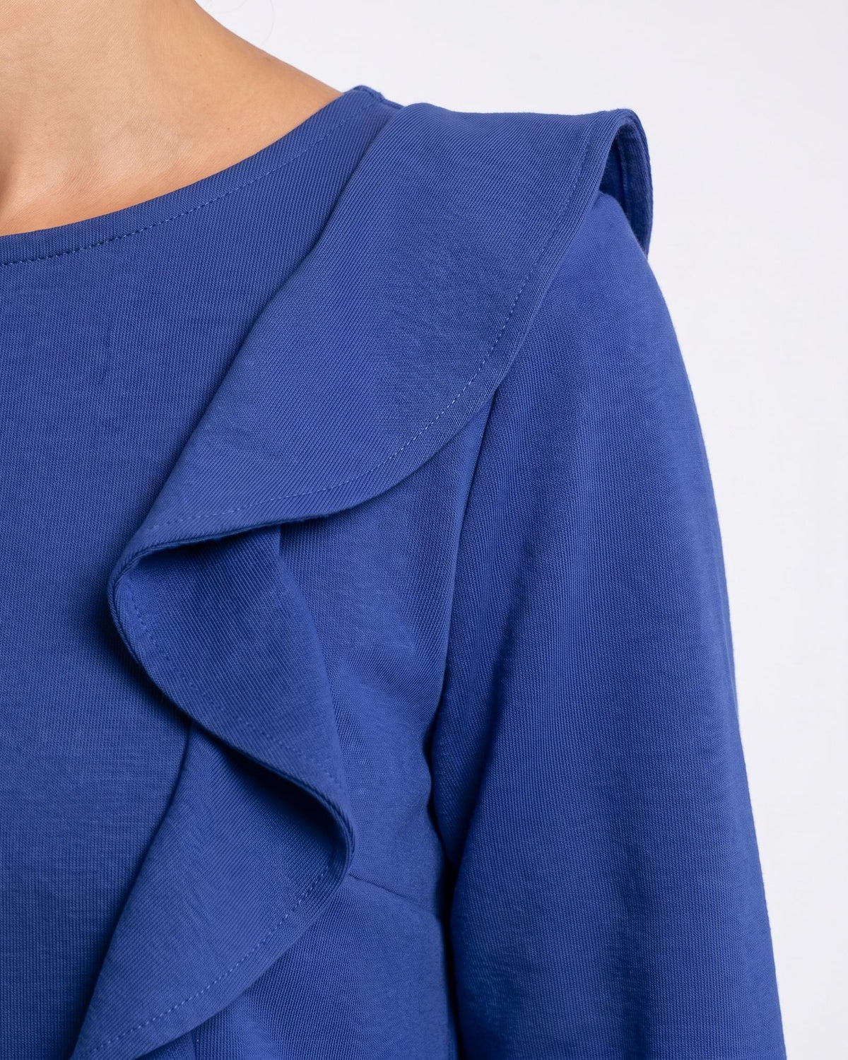 BUTTERFLY – Italian Punto Milano Ruffle A-Line Dress – sapphire blue dress, close-up of one of the two matching shoulder ruffles and the fine punto milano knit #Color_Sapphire blue
