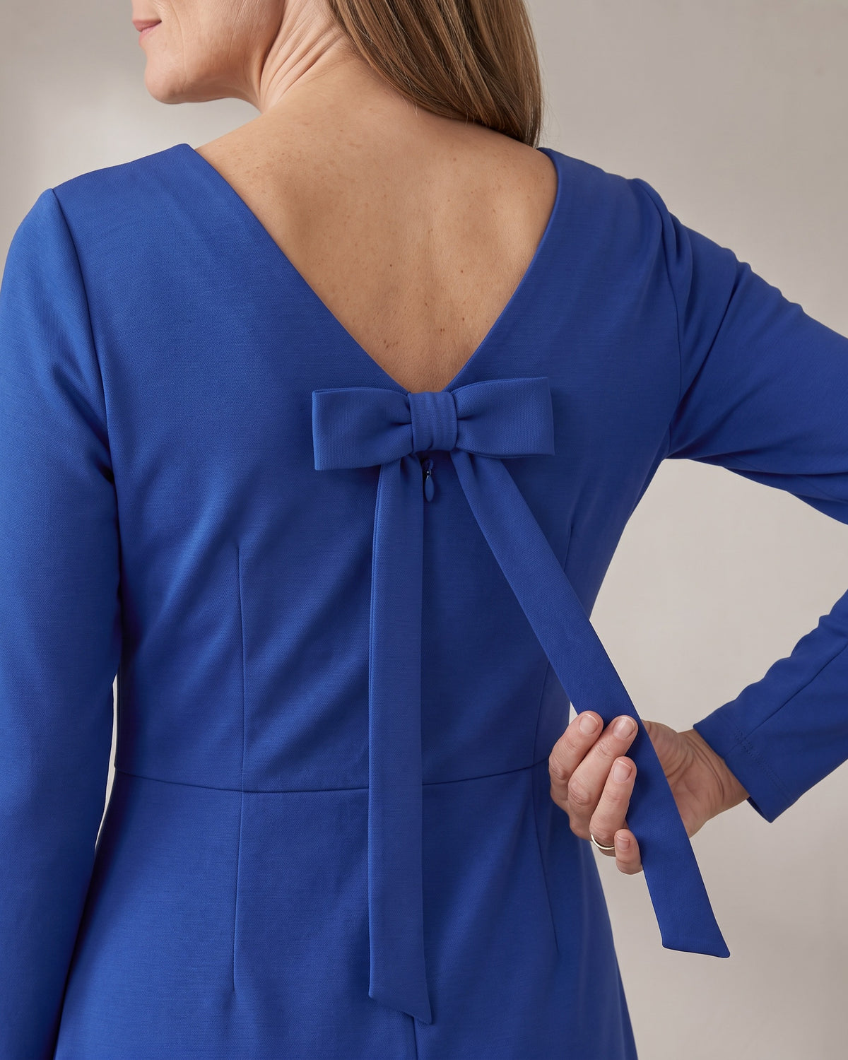 CLARA back bow detail in Cobalt: flat knot and narrow ties