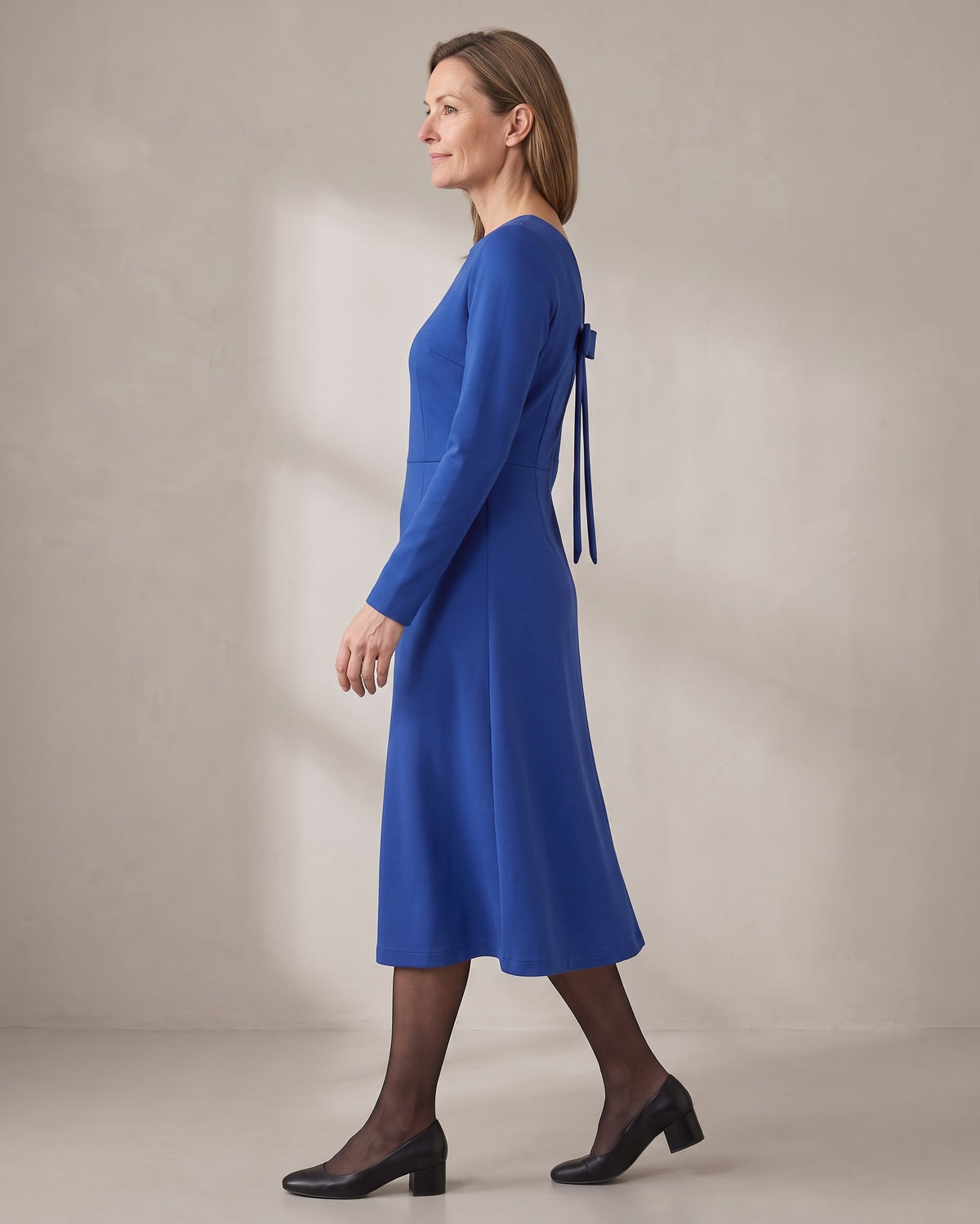CLARA midi dress in Cobalt, side view showing the shaped waist and A-line skirt
