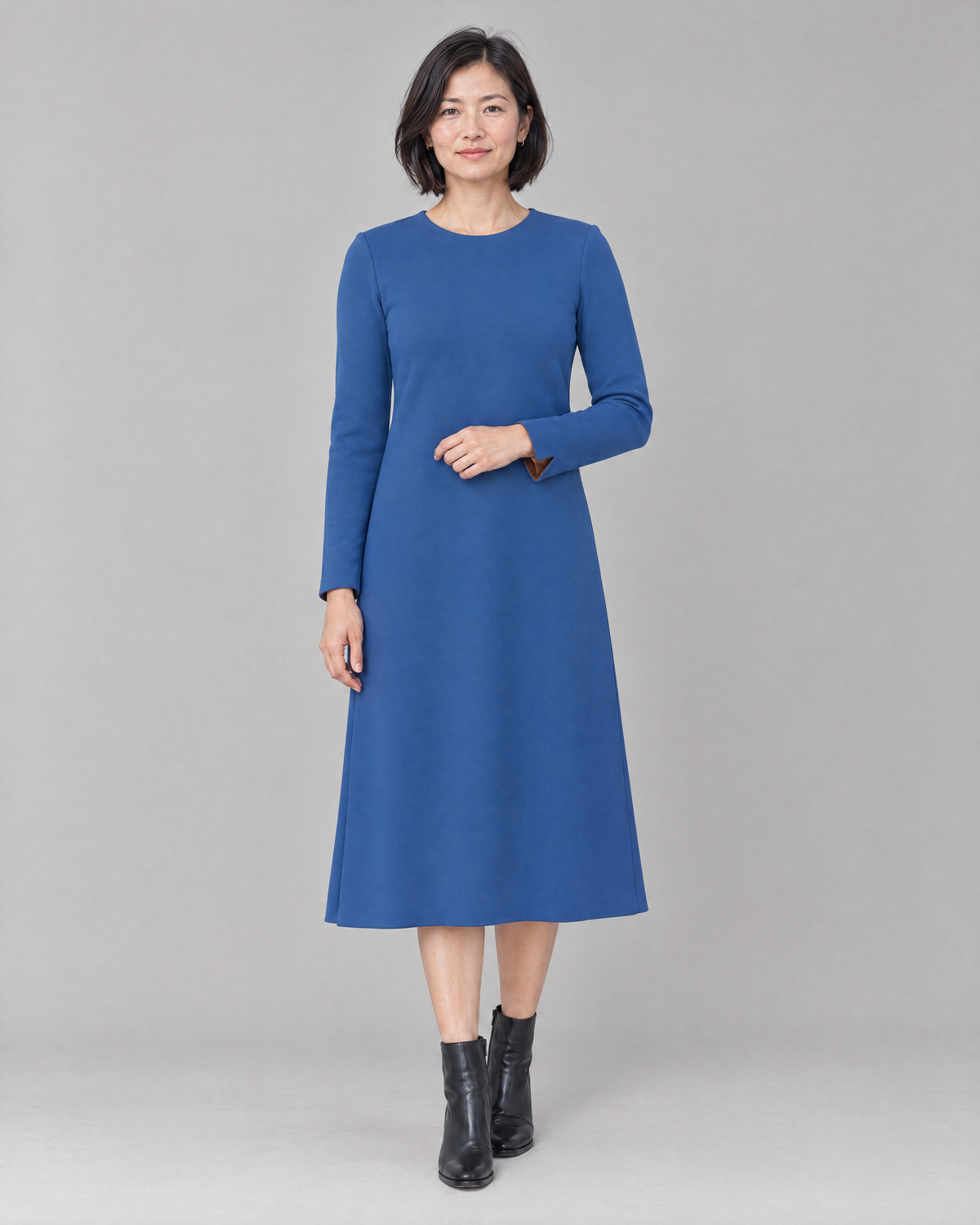 COATFIT A-line midi dress in blue Punto knit, front view
