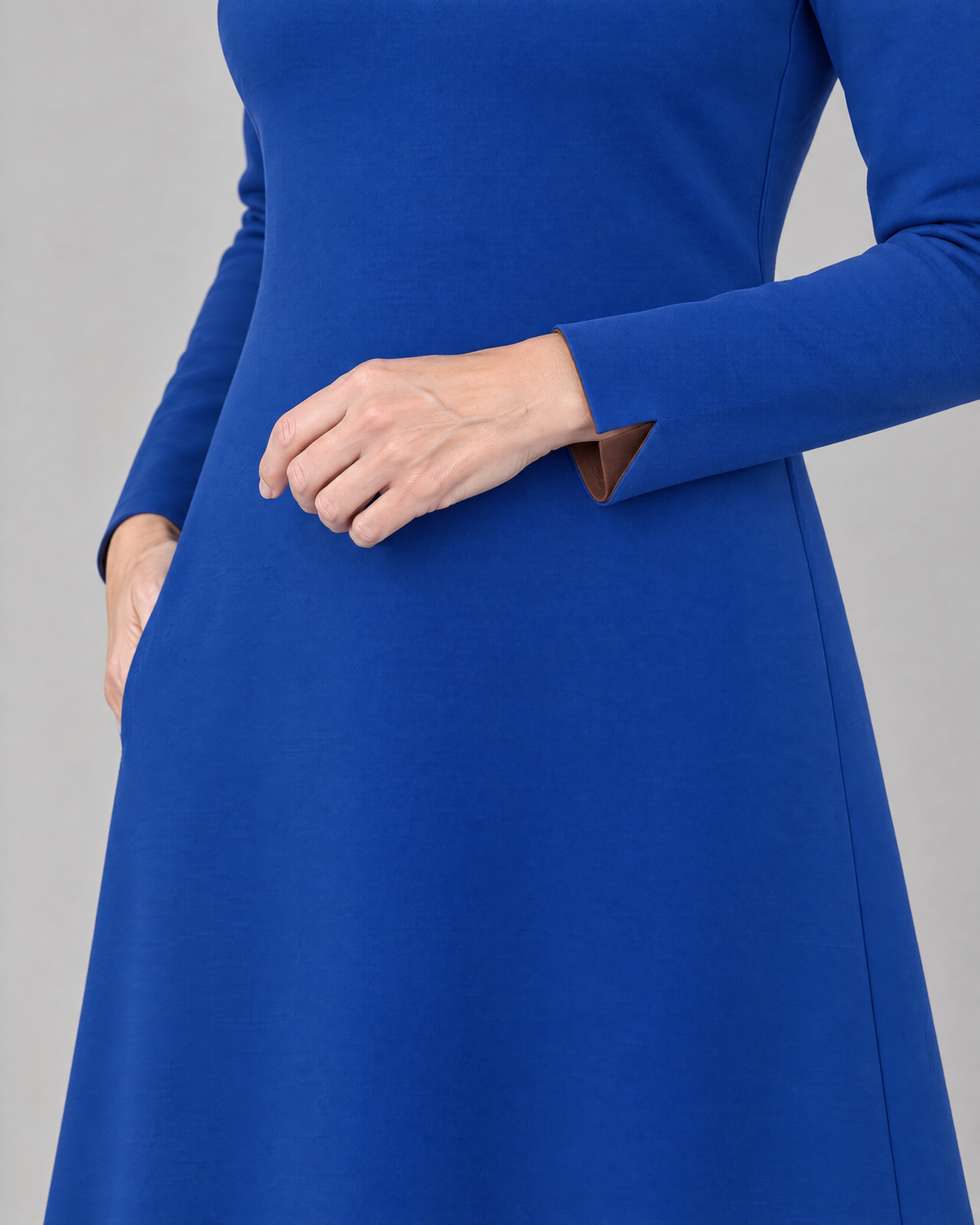 COATFIT cobalt blue double cuff with brown contrast vent, close-up