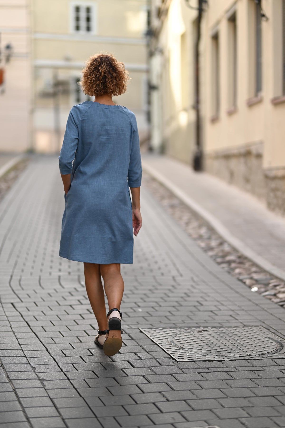 LeMuse FRENCH linen dress in blue – back view walking #Color_Blue