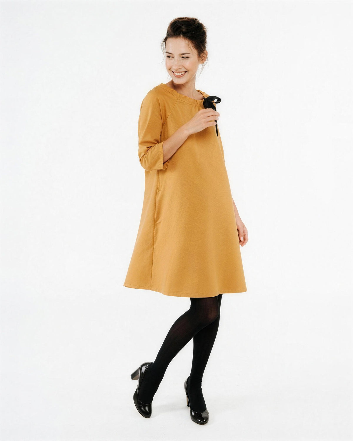 FRENCH – Italian Punto Milano Ribbon Neck A-Line Dress – yellow dress, front view: three-quarter sleeve knit A-line dress with a black satin ribbon bow at the neckline, full length on a light studio background #Color_Yellow