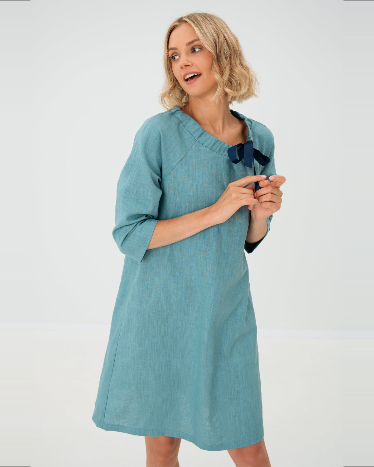 LeMuse FRENCH linen dress in teal – studio three-quarter front view #Color_Teal