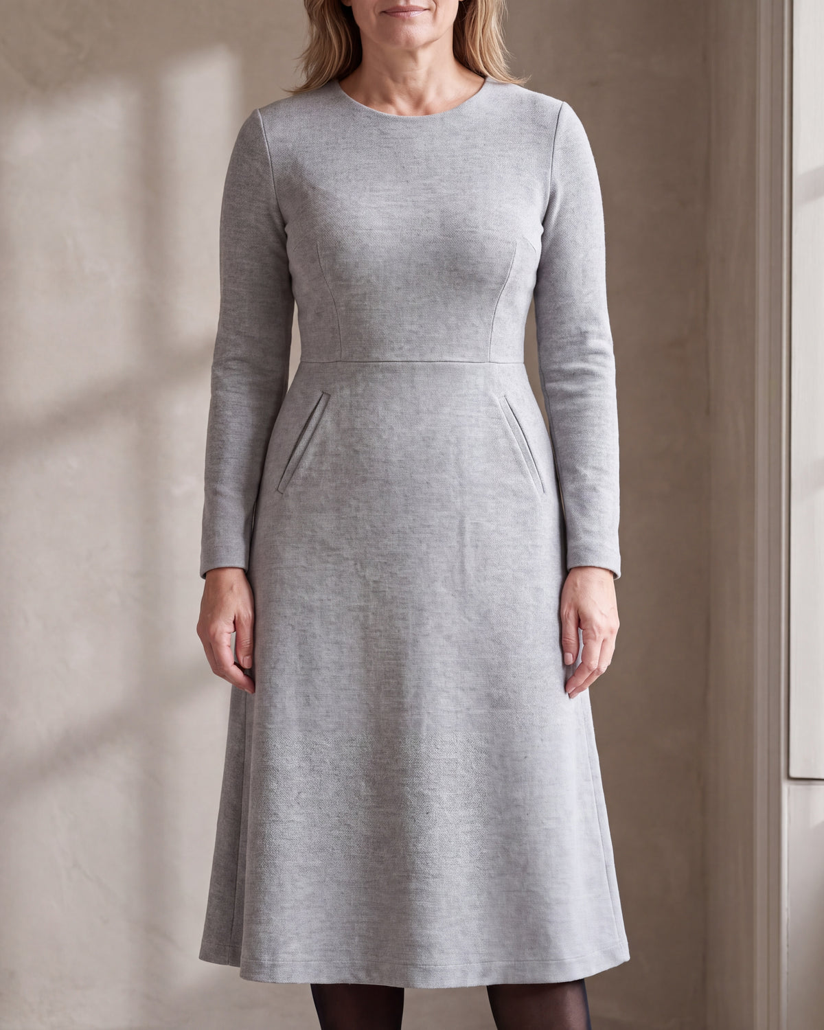 GLIDE light grey wool A-line midi dress with welt pockets, close front view
