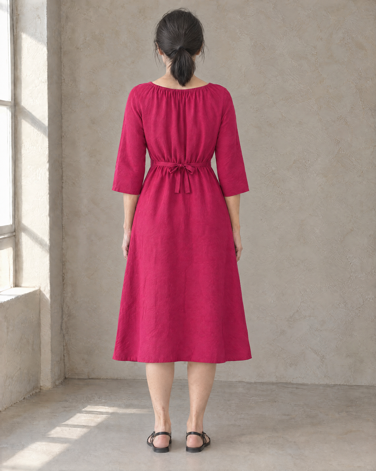HELENA linen dress in Cerise, back view with tied waist